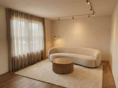 The same furnished living room seen from a corner, showing two walls